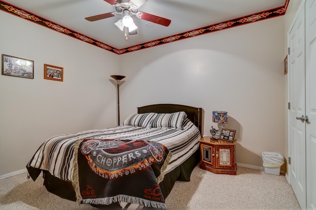 carpeted bedroom with ceiling fan