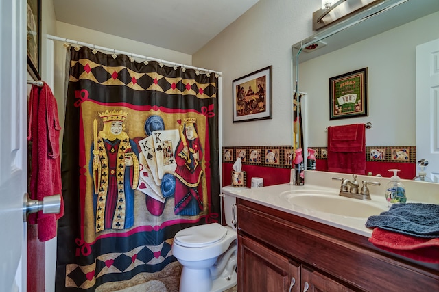 bathroom featuring vanity, toilet, and a shower with shower curtain