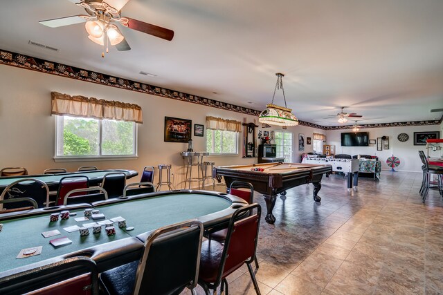 game room with pool table and ceiling fan