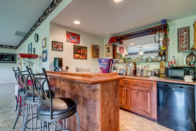 bar featuring black appliances and ceiling fan