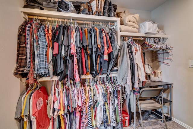 walk in closet featuring carpet floors