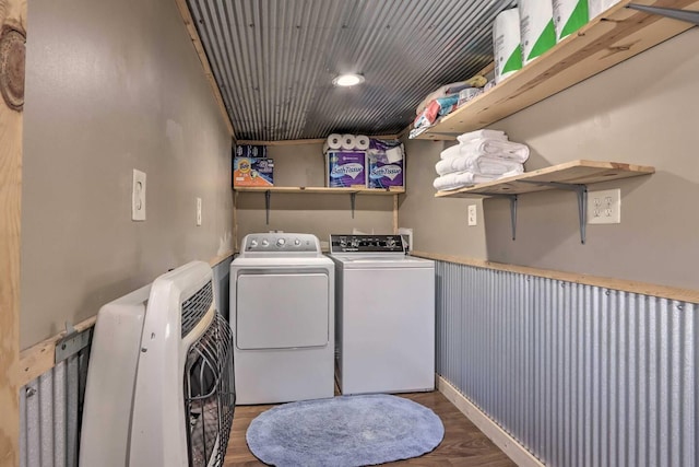 laundry room featuring washing machine and dryer and dark hardwood / wood-style flooring