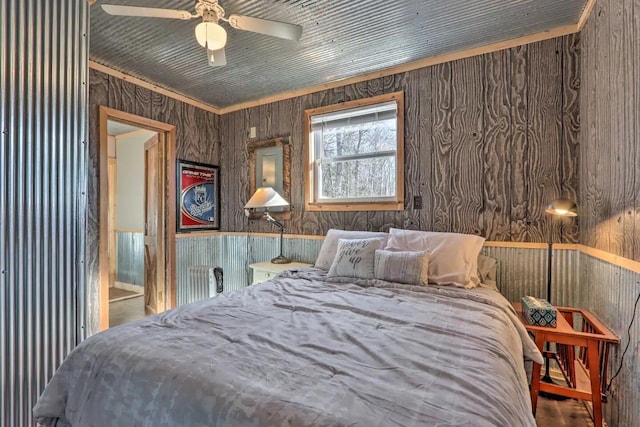 3142 Fishin Hole Rd, Flemington, MO 65650 - bedroom with ceiling fan and wooden walls