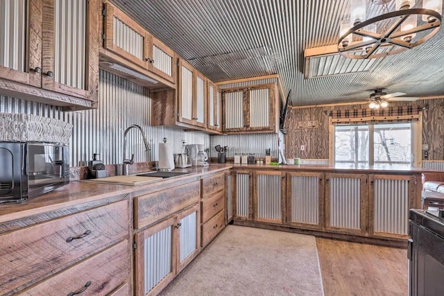 3142 Fishin Hole Rd, Flemington, MO 65650 - kitchen featuring a ceiling fan, a toaster, a sink, and light wood-style flooring