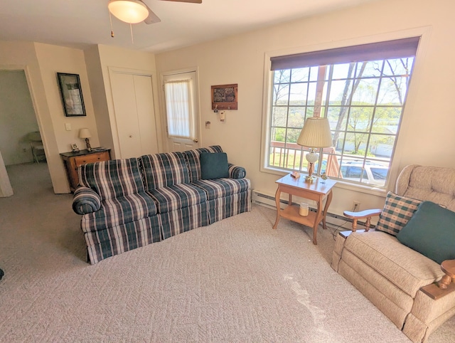 living room featuring carpet floors and ceiling fan