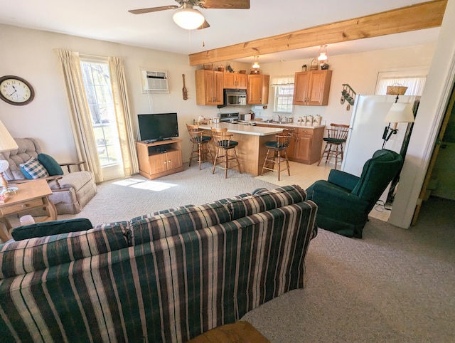 living room with ceiling fan, light colored carpet, and an AC wall unit