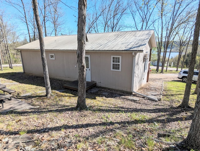 view of property exterior featuring a lawn