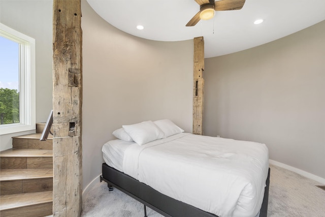 carpeted bedroom featuring ceiling fan