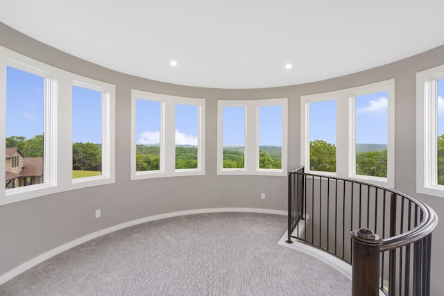 unfurnished sunroom with a wealth of natural light