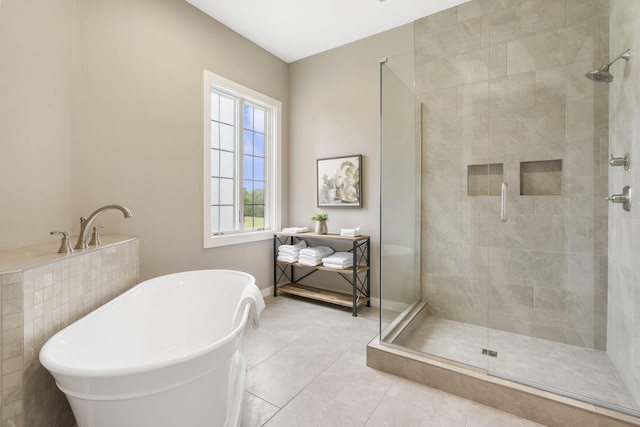 bathroom featuring separate shower and tub and tile patterned floors