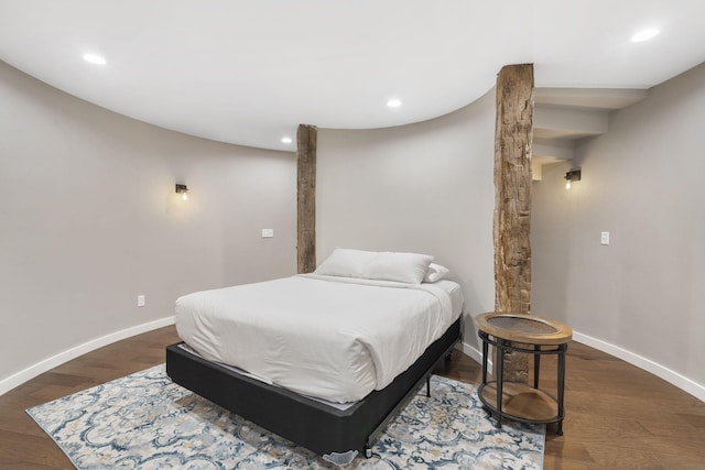 bedroom with dark wood-type flooring