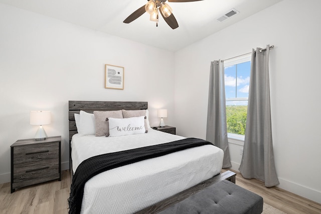 bedroom with light wood-type flooring and ceiling fan