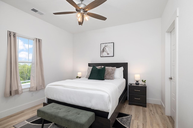 bedroom with light wood-type flooring and ceiling fan