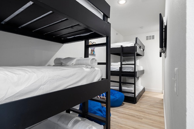 bedroom with light wood-type flooring