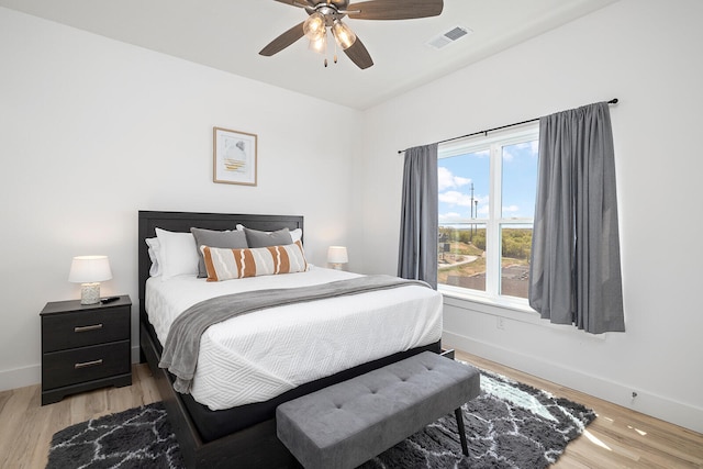 bedroom with ceiling fan and light hardwood / wood-style flooring