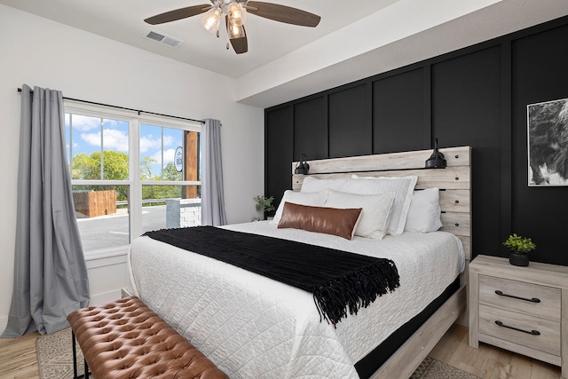 bedroom with ceiling fan and light hardwood / wood-style floors