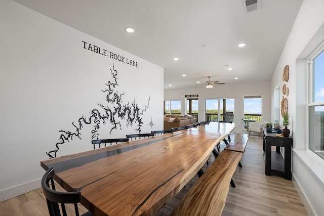 dining room with ceiling fan and light hardwood / wood-style flooring