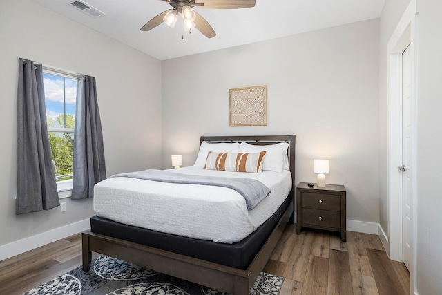 bedroom with hardwood / wood-style flooring and ceiling fan