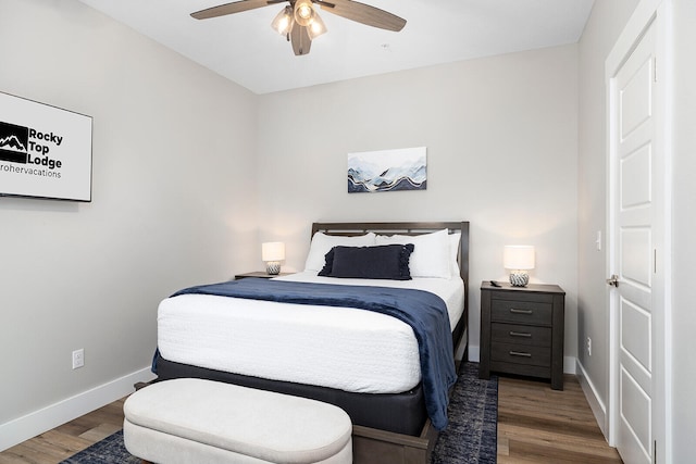 bedroom with ceiling fan and hardwood / wood-style floors