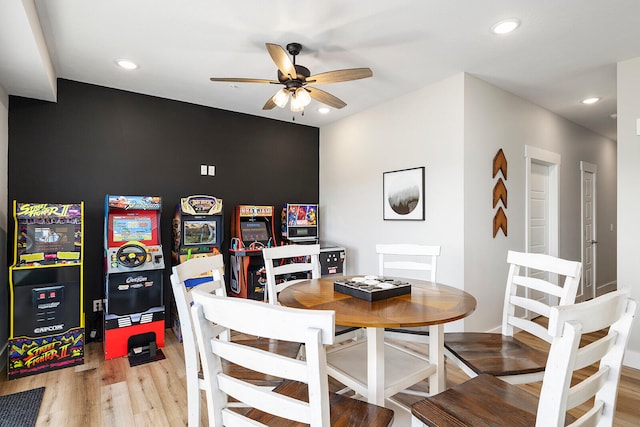 dining room featuring light hardwood / wood-style flooring and ceiling fan