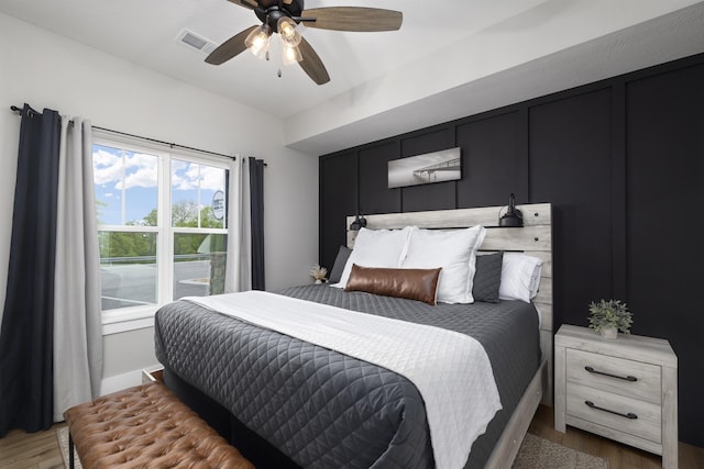 bedroom featuring hardwood / wood-style flooring and ceiling fan