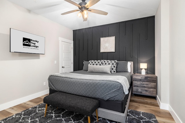 bedroom featuring ceiling fan and hardwood / wood-style floors