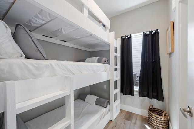 bedroom with light wood-type flooring