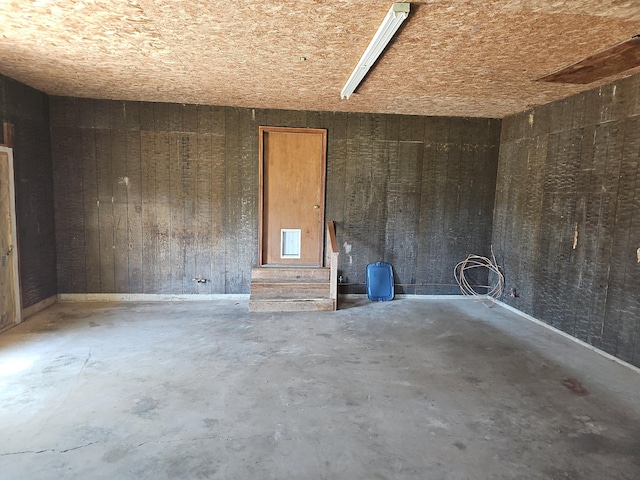 spare room featuring unfinished concrete floors