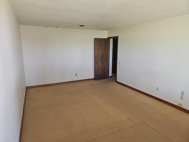 empty room with baseboards