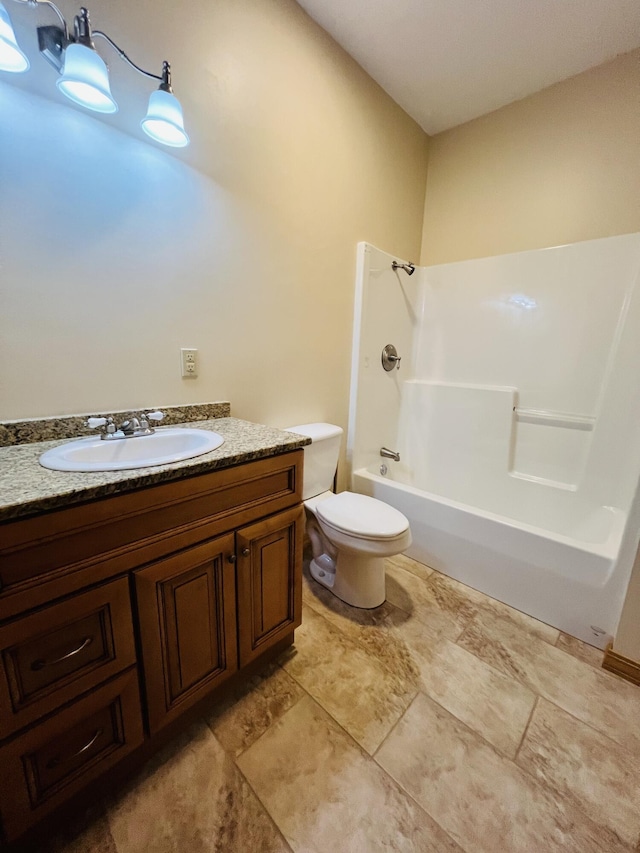 full bathroom with toilet, vanity, and shower / tub combination
