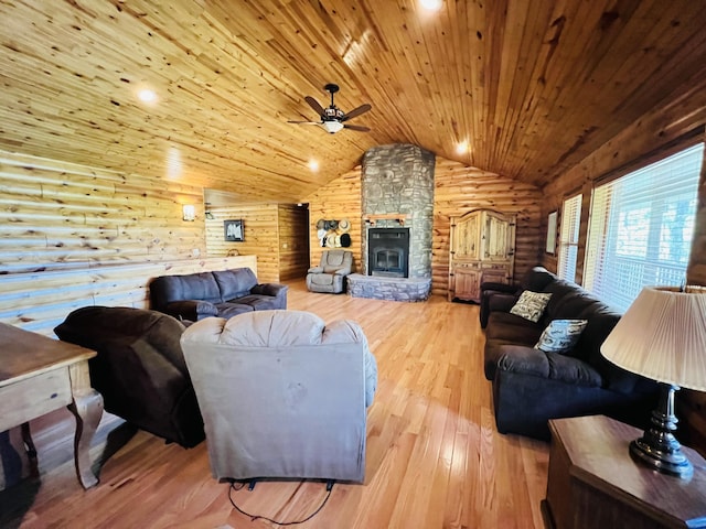 living area featuring vaulted ceiling, wood finished floors, wood ceiling, log walls, and ceiling fan