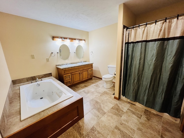 full bath with a jetted tub, toilet, vanity, a shower with curtain, and a textured ceiling