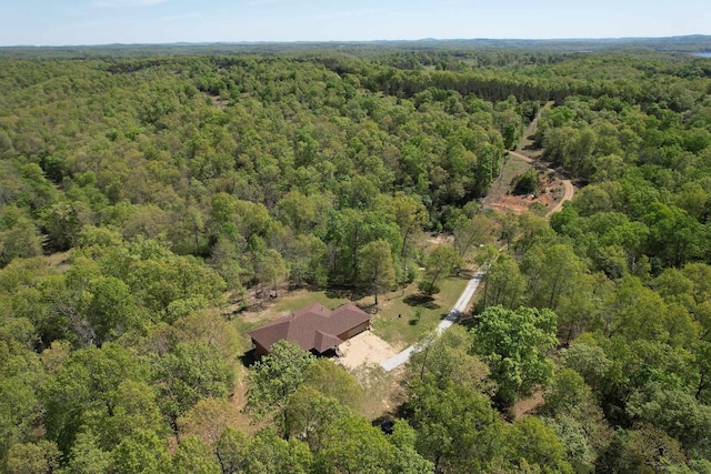 drone / aerial view featuring a forest view