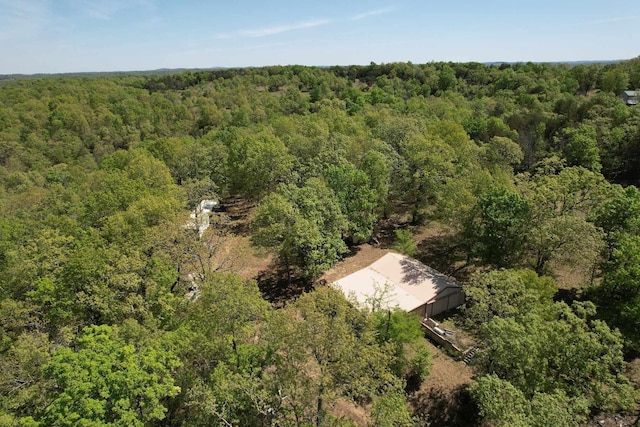 drone / aerial view featuring a view of trees
