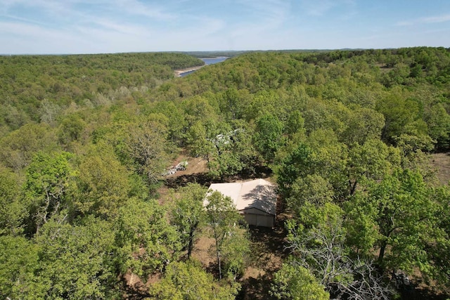 birds eye view of property with a forest view