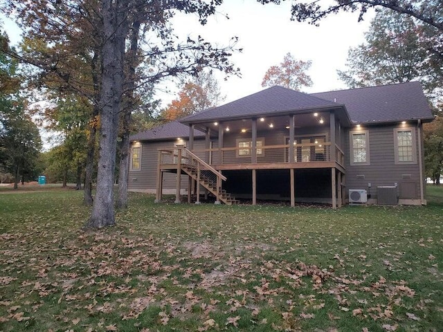 21942 Mill Creek Cir, Shell Knob, MO 65747 - rear view of property featuring a lawn, central AC unit, stairway, and a deck
