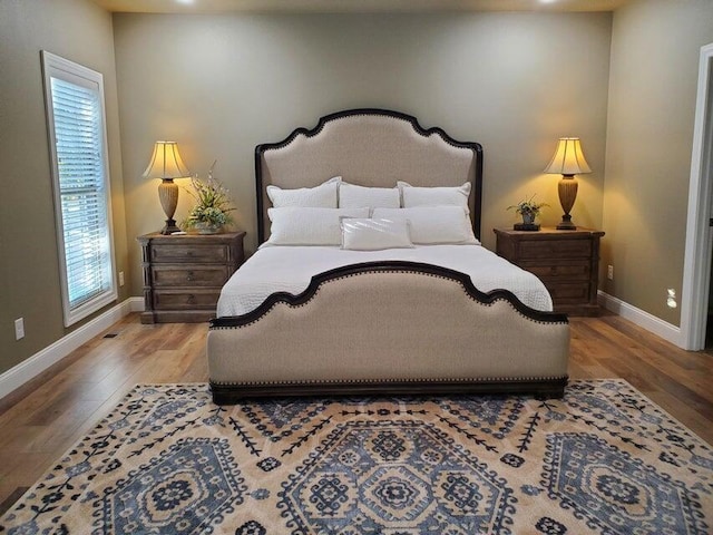 21942 Mill Creek Cir, Shell Knob, MO 65747 - bedroom with baseboards and wood finished floors