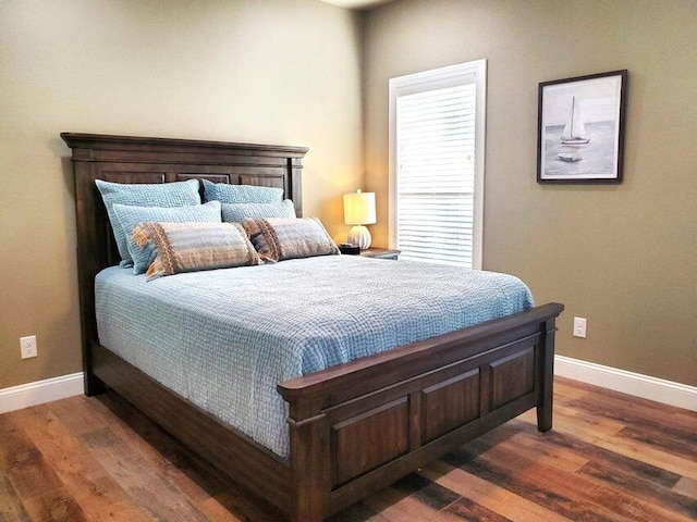 21942 Mill Creek Cir, Shell Knob, MO 65747 - bedroom with wood finished floors and baseboards