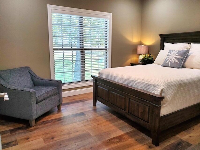 21942 Mill Creek Cir, Shell Knob, MO 65747 - bedroom with wood finished floors and baseboards