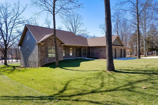 21942 Mill Creek Cir, Shell Knob, MO 65747 - view of front facade with a front lawn, driveway, a garage, brick siding, and roof with shingles
