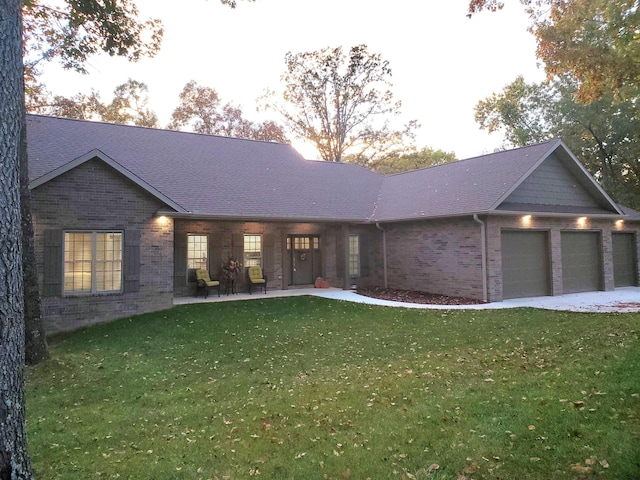 21942 Mill Creek Cir, Shell Knob, MO 65747 - ranch-style house featuring an attached garage, brick siding, a shingled roof, and a front yard