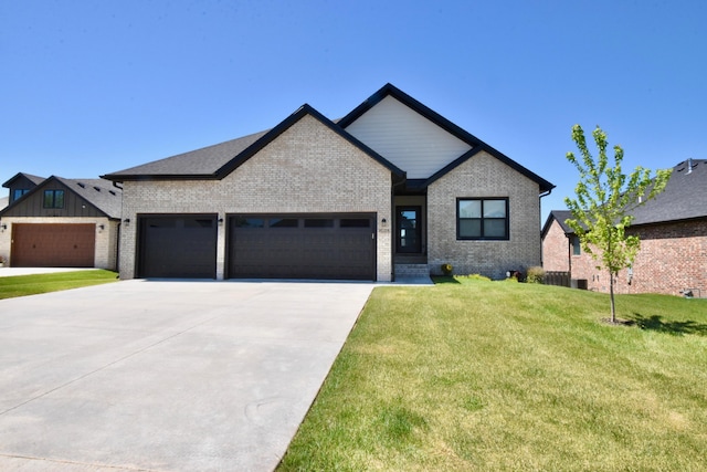 view of front facade with a front yard and a garage