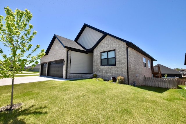 view of front facade featuring a front yard and a garage