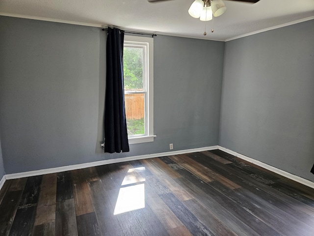 empty room featuring ornamental molding, dark hardwood / wood-style flooring, and ceiling fan