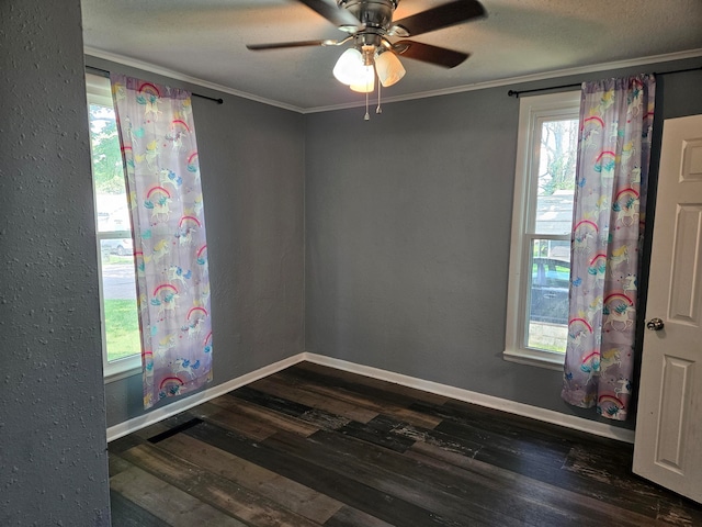 spare room featuring dark hardwood / wood-style floors, crown molding, a textured ceiling, and ceiling fan