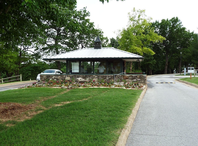 view of front of house with a front yard and a porch