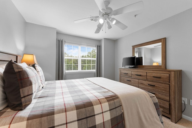 bedroom with light carpet and ceiling fan