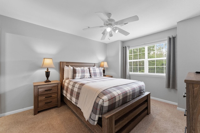 bedroom with light colored carpet and ceiling fan