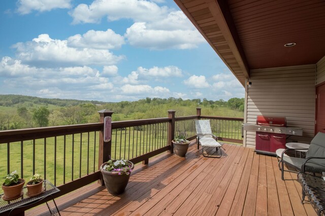 wooden deck with a lawn