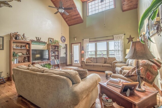 living room featuring high vaulted ceiling, hardwood / wood-style flooring, and ceiling fan